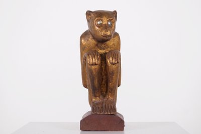 Figure rituelle de singe en bois doré