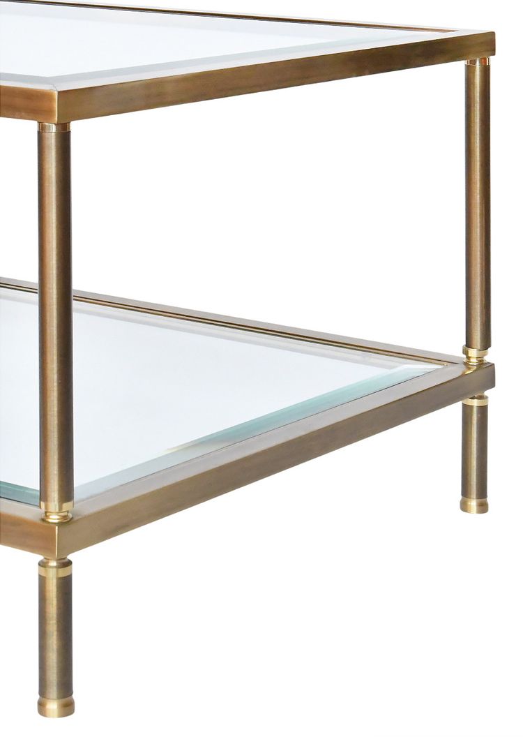 Table basse en laiton doré et deux plateaux en verre biseauté  