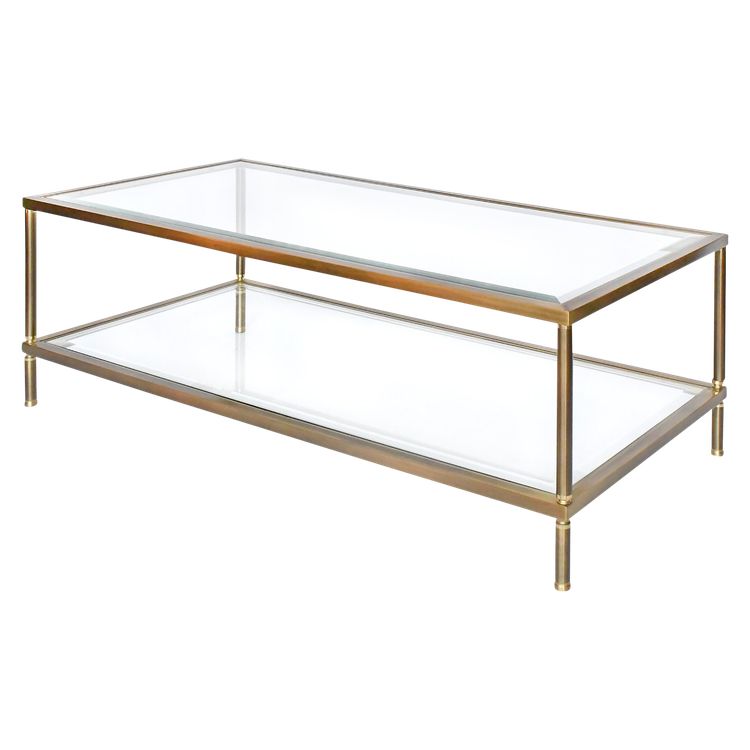 Table basse en laiton doré et deux plateaux en verre biseauté  