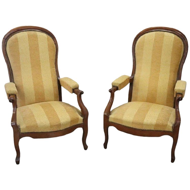 Set di due poltrone reclinabili imbottite in noce antiche