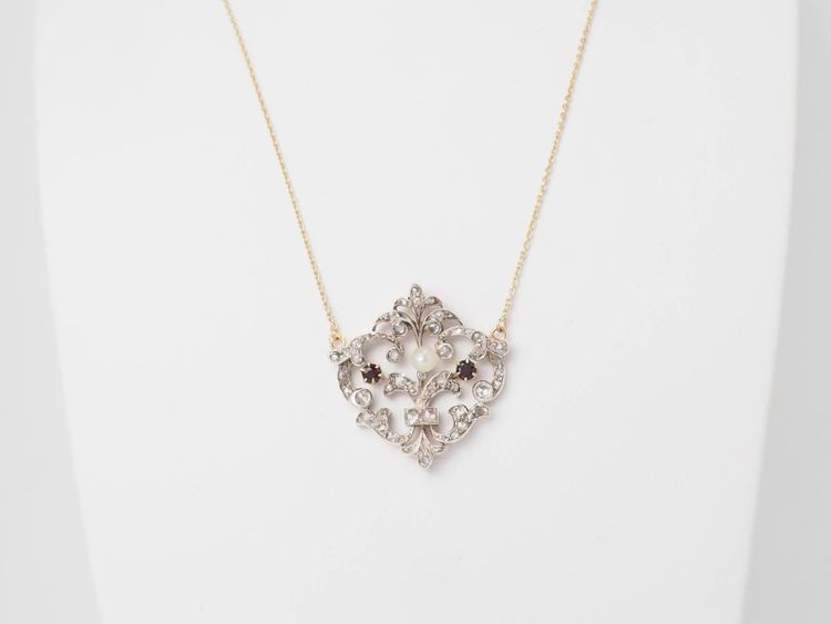 Collier volutes en or jaune et argent, grenat diamants et perle