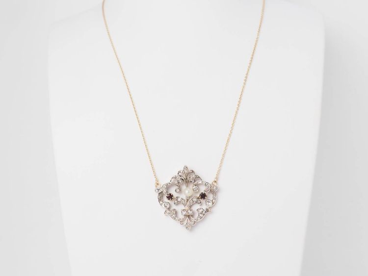 Collier volutes en or jaune et argent, grenat diamants et perle