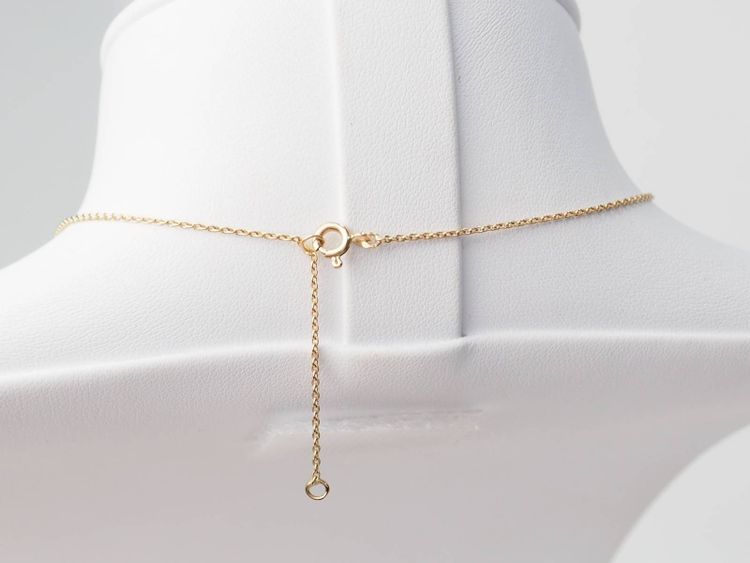 Collier volutes en or jaune et argent, grenat diamants et perle