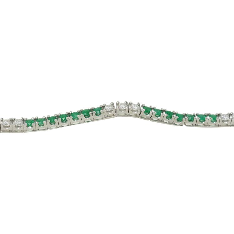 Bracciale fiume in oro bianco, smeraldi e diamanti