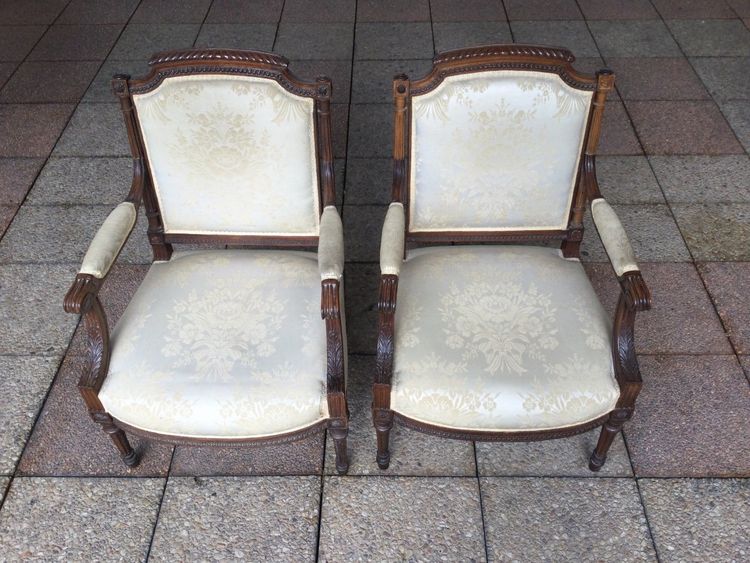 Pair of Louis XVI armchairs with flat backs.