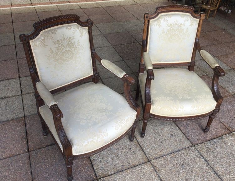 Pair of Louis XVI armchairs with flat backs.