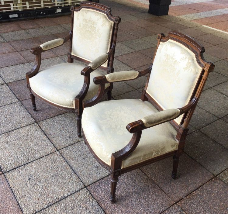 Pair of Louis XVI armchairs with flat backs.