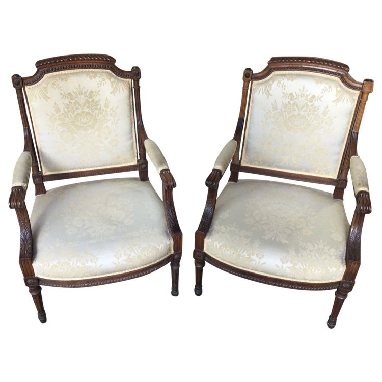 Pair of Louis XVI armchairs with flat backs.