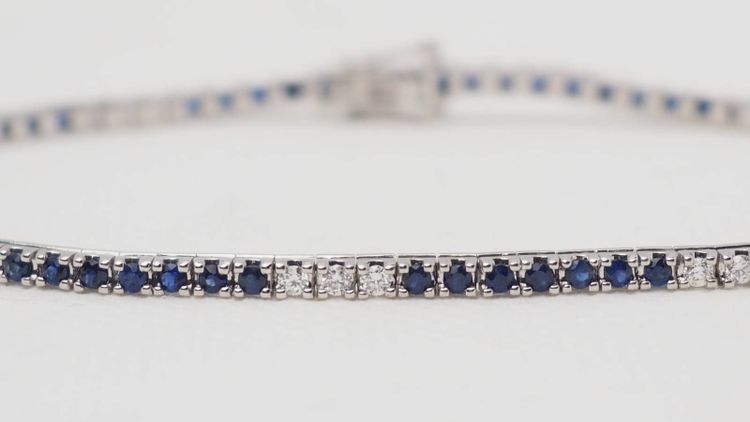 Bracciale fiume in oro bianco, zaffiri e diamanti