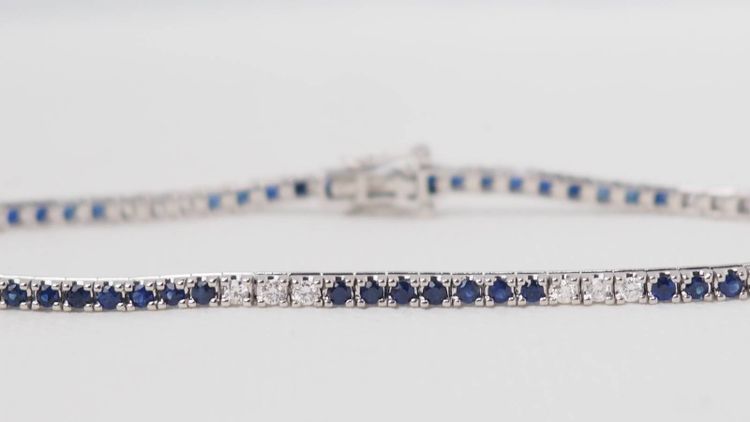 Bracciale fiume in oro bianco, zaffiri e diamanti