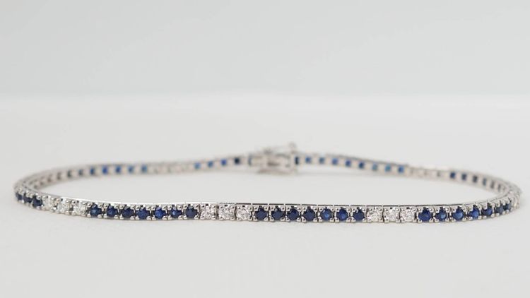 Bracciale fiume in oro bianco, zaffiri e diamanti