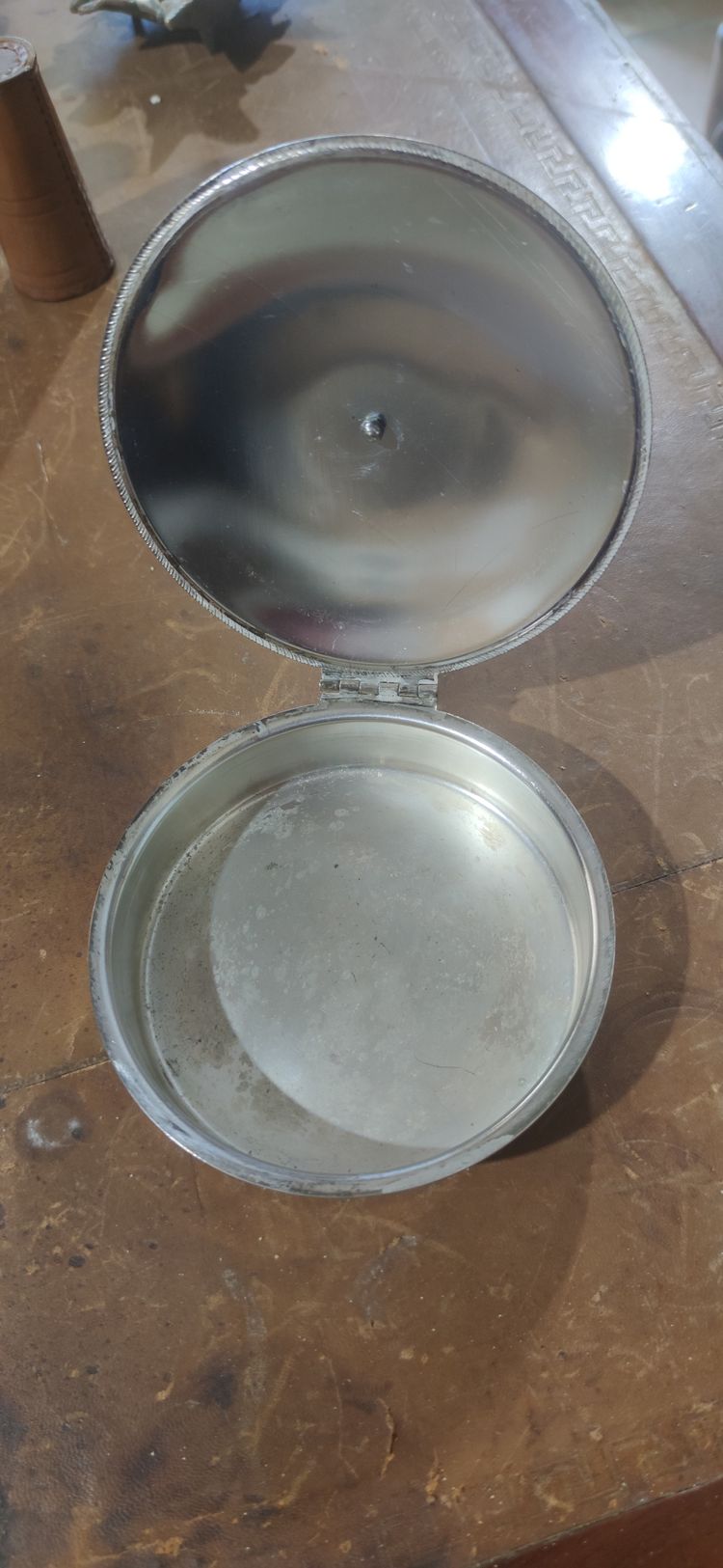 Covered pan with wooden handle and badge
