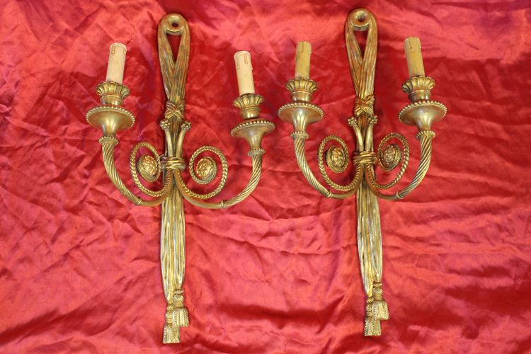 Pair of large bronze sconces with passementerie decoration in the 19th century Louis XVI style h: 60 cm