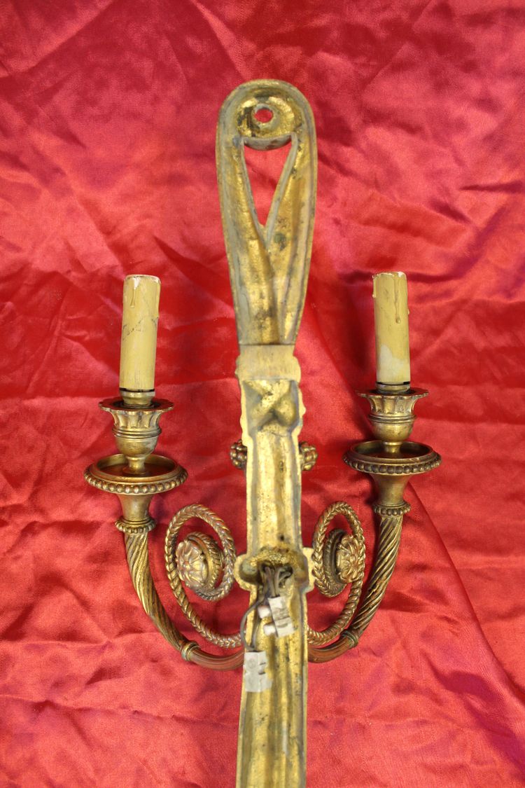 Pair of large bronze sconces with passementerie decoration in the 19th century Louis XVI style h: 60 cm