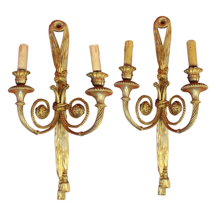 Pair of large bronze sconces with passementerie decoration in the 19th century Louis XVI style h: 60 cm