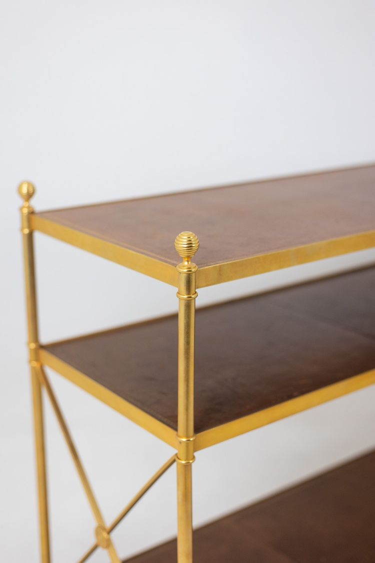 Casa Jansen. Console in ottone dorato e pelle fulva. Circa 1970.  LS64292509I