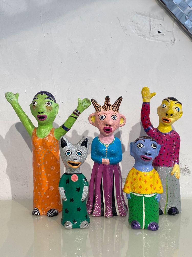 Papier-mâché sculptures "La petite famille" signed by artist Wabé and dated 2003