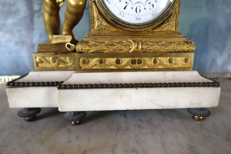 Gilt bronze clock "l'angelot au coq" Louis XVI style, 19th century