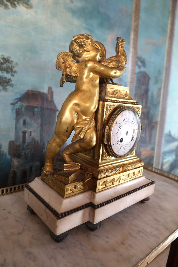 Gilt bronze clock "l'angelot au coq" Louis XVI style, 19th century