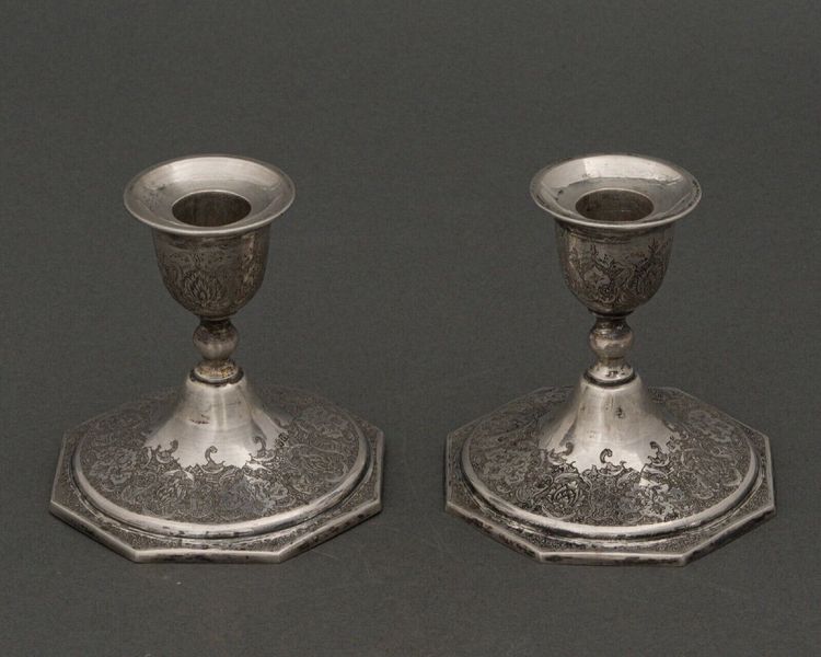 Pair of 19th century Persian silver candlesticks, engraved with bird design, hallmarked 84