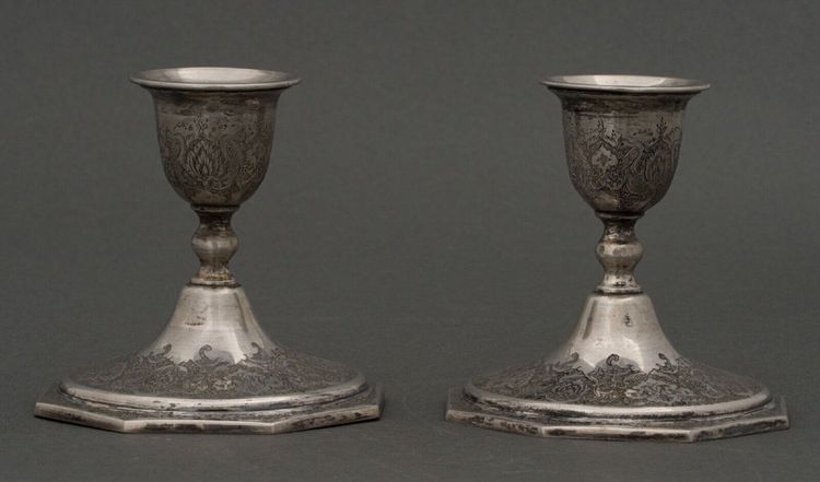 Pair of 19th century Persian silver candlesticks, engraved with bird design, hallmarked 84