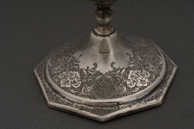 Pair of 19th century Persian silver candlesticks, engraved with bird design, hallmarked 84