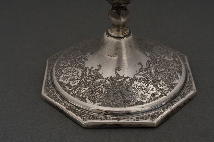 Pair of 19th century Persian silver candlesticks, engraved with bird design, hallmarked 84