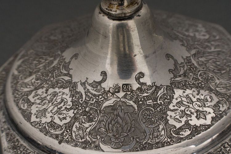 Pair of 19th century Persian silver candlesticks, engraved with bird design, hallmarked 84