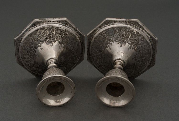 Pair of 19th century Persian silver candlesticks, engraved with bird design, hallmarked 84