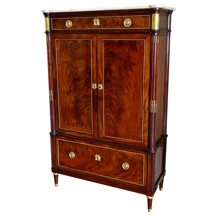 Louis XVI period command cabinet in flamed mahogany and gilt bronze, trefoil lock