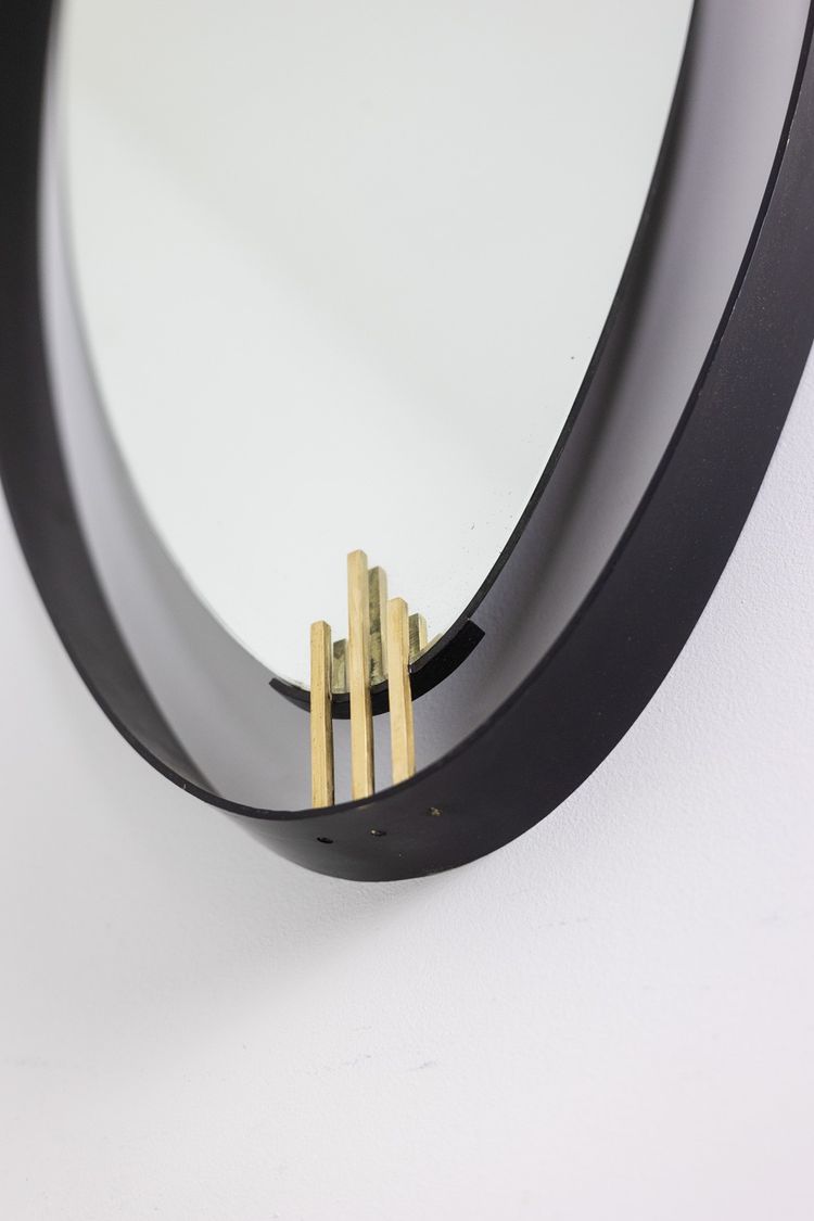 Lacquered and patinated brass mirror, ovoid shape. 1950s/60s. LS6351736M