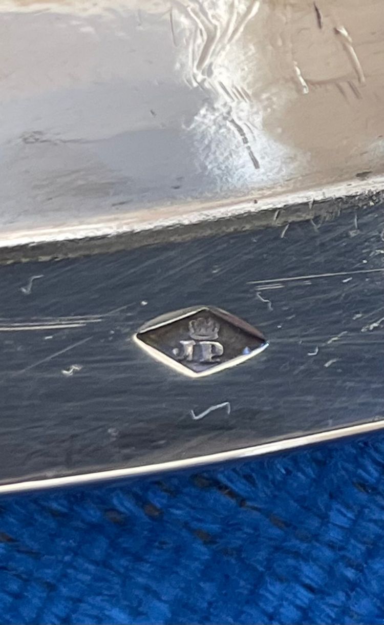 Semi-hollow solid silver dish.