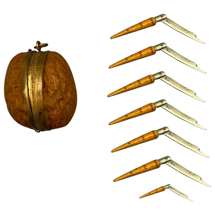 WALNUT SHELL and its 7 miniature NONTRON KNIVES - France - 20th century