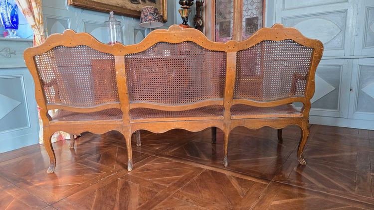 Louis XV period sofa with cane base, Lyonnais work attributed to Pierre Nogaret.