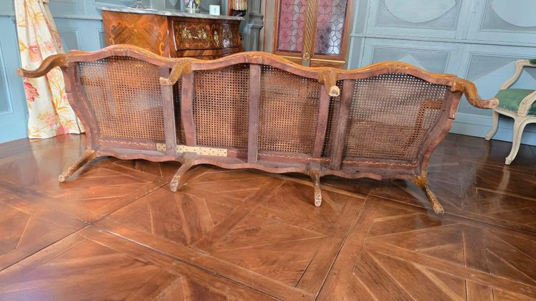 Louis XV period sofa with cane base, Lyonnais work attributed to Pierre Nogaret.