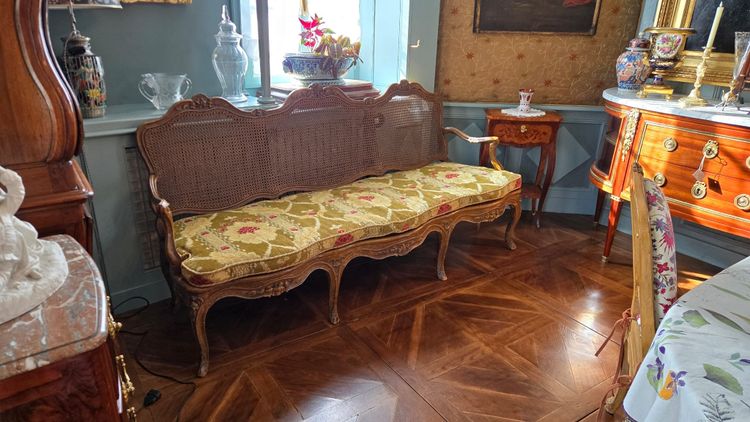 Louis XV period sofa with cane base, Lyonnais work attributed to Pierre Nogaret.