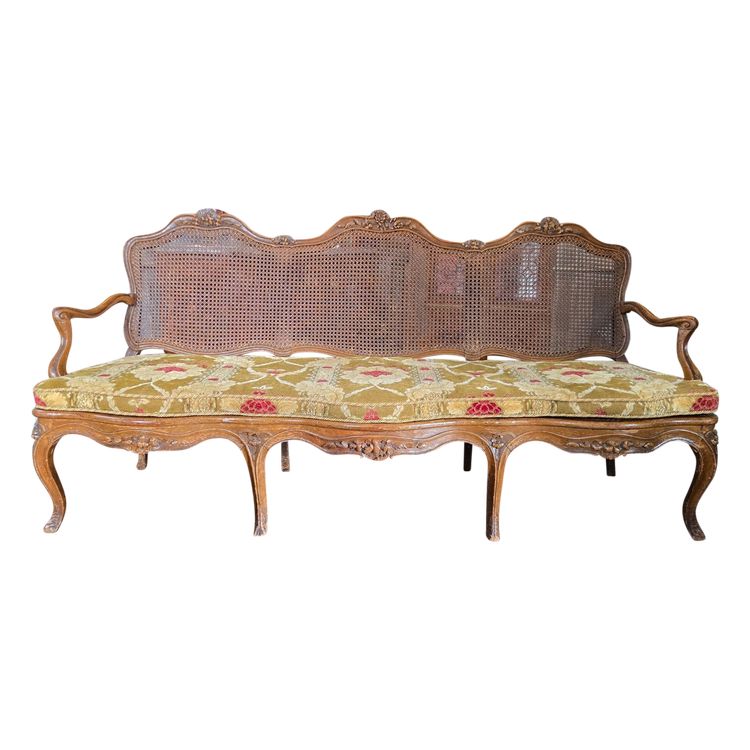 Louis XV period sofa with cane base, Lyonnais work attributed to Pierre Nogaret.