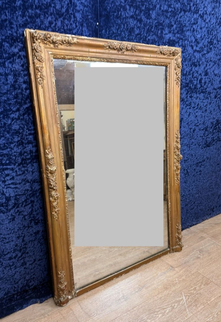 Empire period mirror in wood and gilded stucco circa 1810-1820