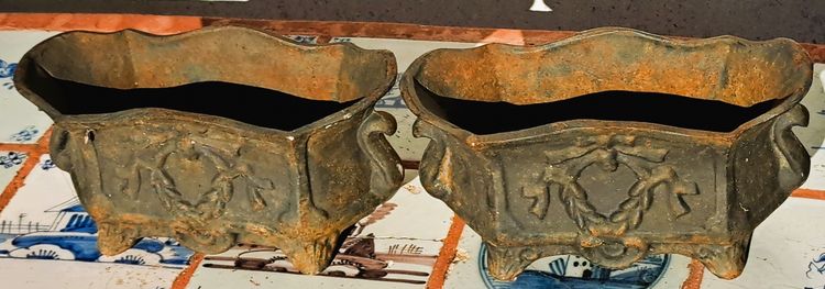 Pair of small cast-iron planters in the Louis XVI style