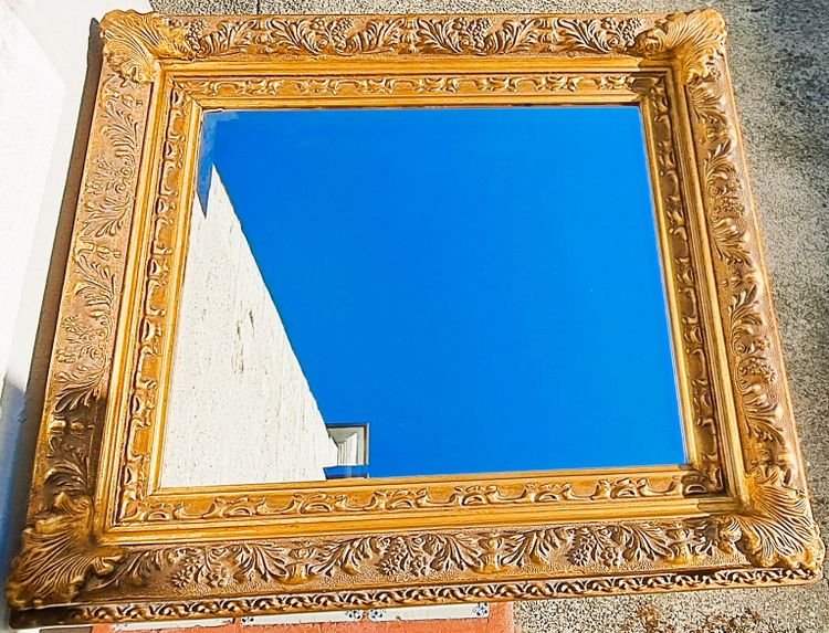 Wooden and gilded stucco bevelled mirror in the Louis XIV Regency style, early 20th century
