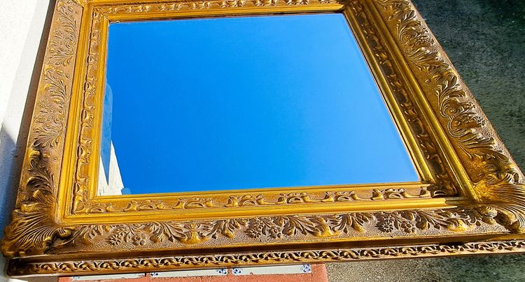 Wooden and gilded stucco bevelled mirror in the Louis XIV Regency style, early 20th century