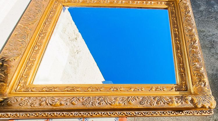 Wooden and gilded stucco bevelled mirror in the Louis XIV Regency style, early 20th century