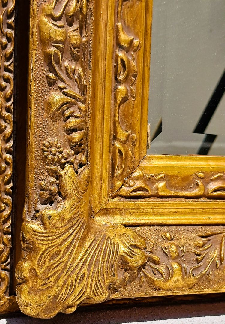 Wooden and gilded stucco bevelled mirror in the Louis XIV Regency style, early 20th century