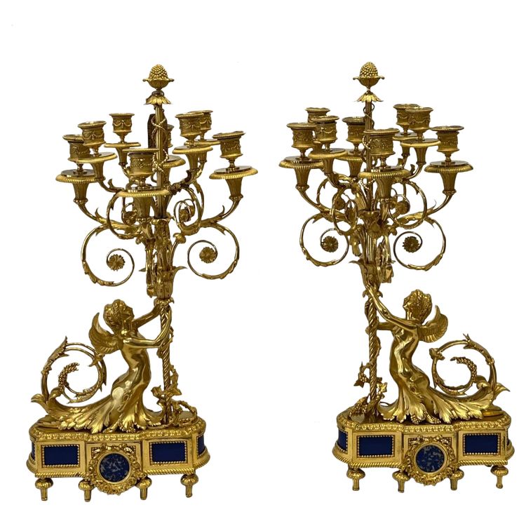 Coppia di candelabri con donne alate XIX secolo.