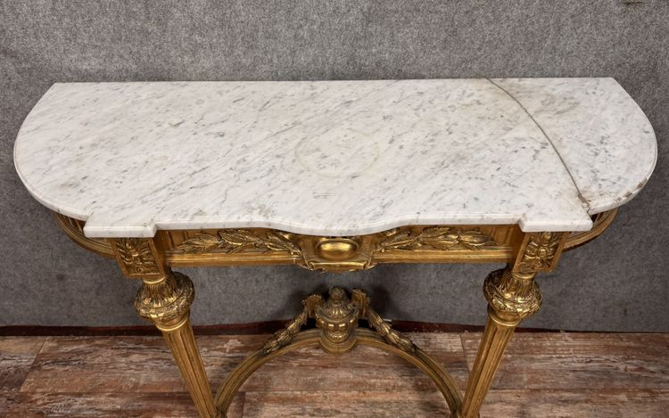 Louis XVI style half-moon console in gilded and carved wood circa 1850