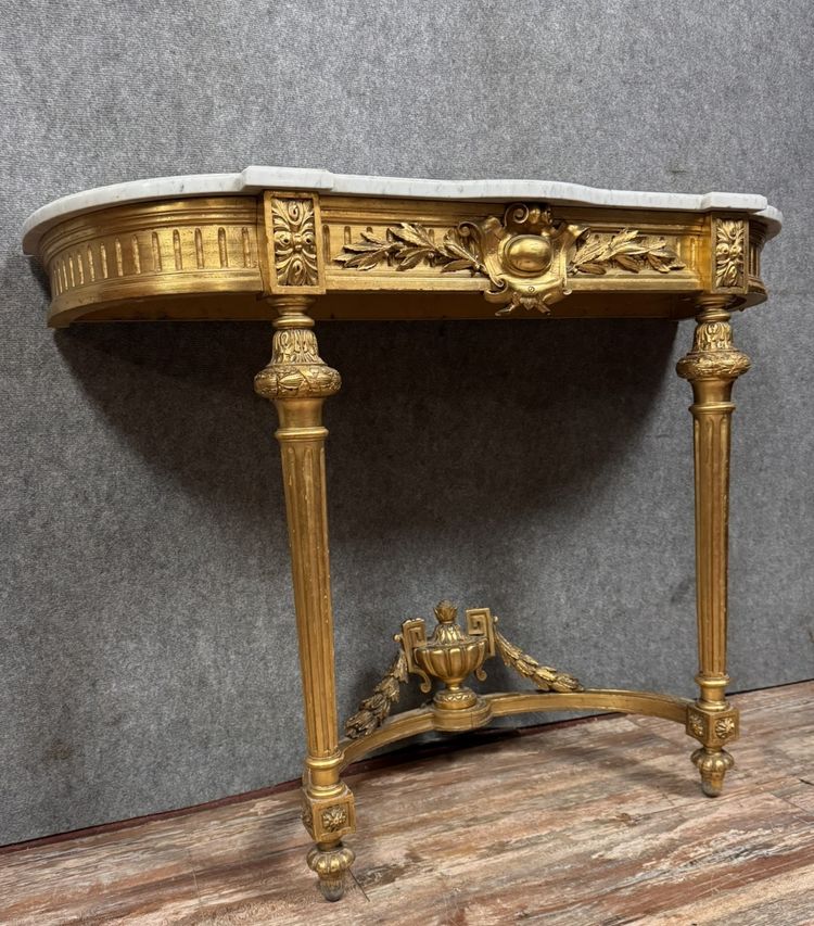 Louis XVI style half-moon console in gilded and carved wood circa 1850