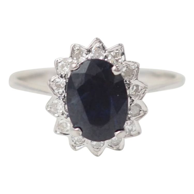 Bague marguerite en or blanc, diamants et saphir ovale