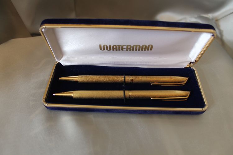 Waterman gold-plated ballpoint pens in box and Globus Judaica silver pen, 20th c.