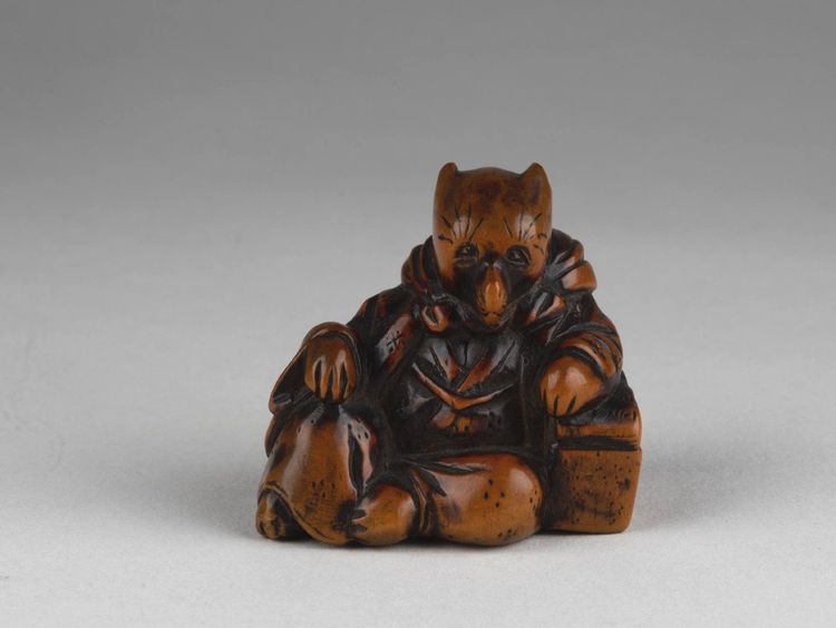 Netsuke - Model representing a fox disguised as a priest. Edo Japan
