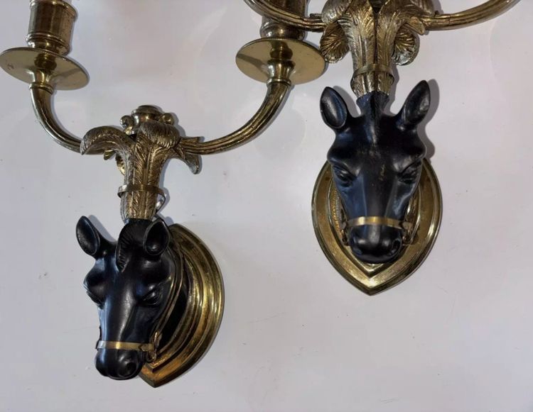 Maison BAGUES, Pair of Gilded Bronze And Black Patina Horse Wall Lights